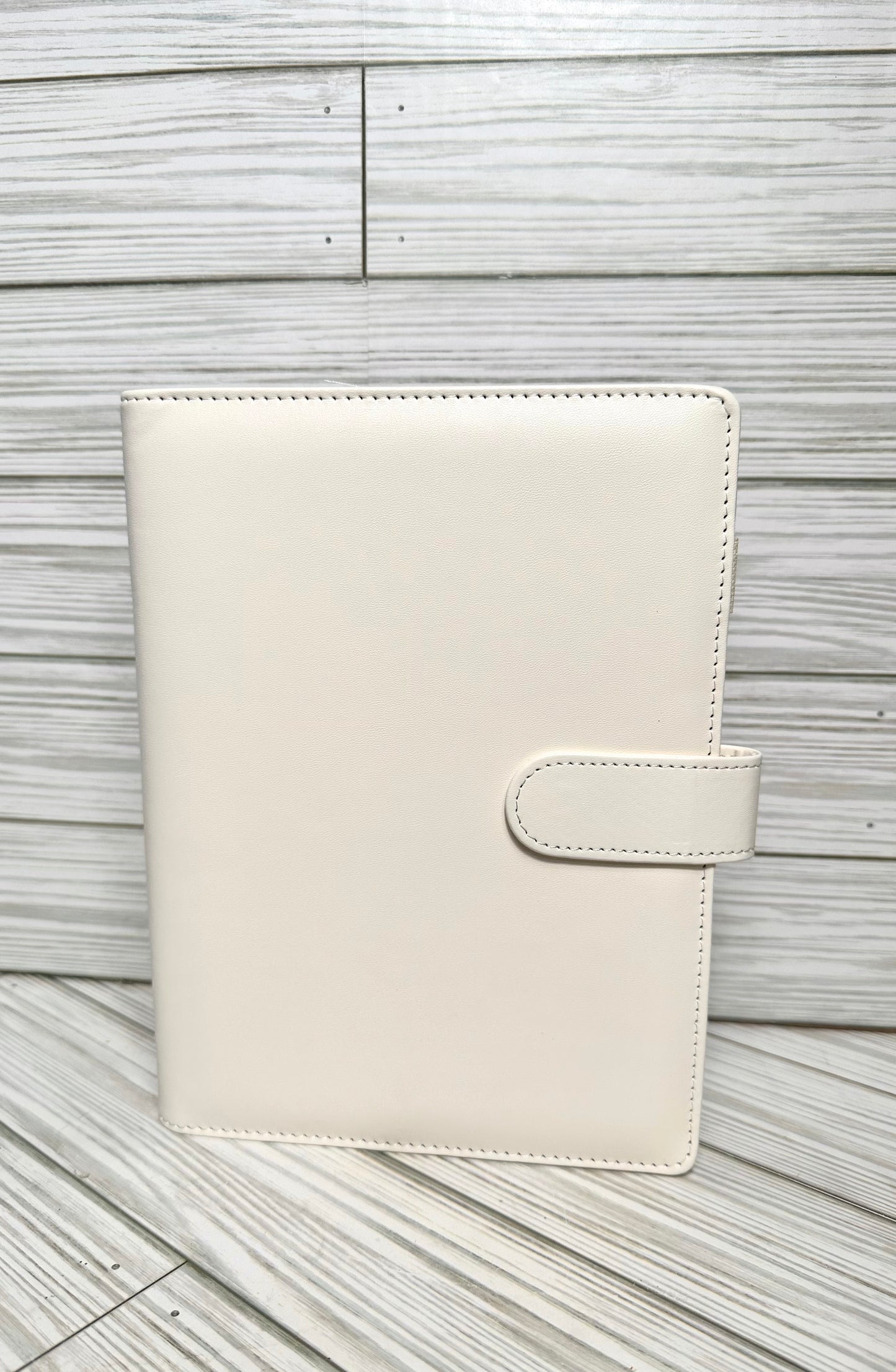 A6 Binders (7.48” lenght by 5.2” width) with your choice of vinyl and rhinestones.